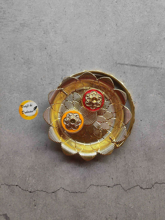 Roli Chawal Plate A13 with raised floral design, gold handle and two center badges