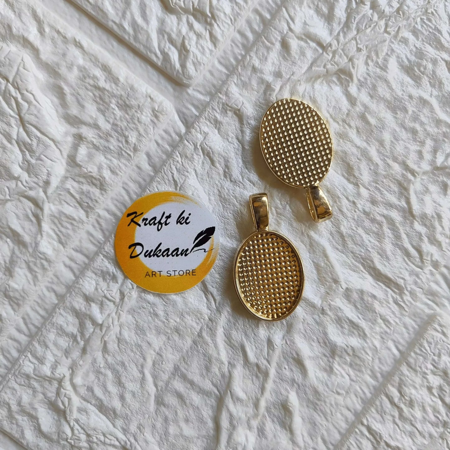 Round metal pendant set (4 pcs), light gold-tone, textured perforated disc design