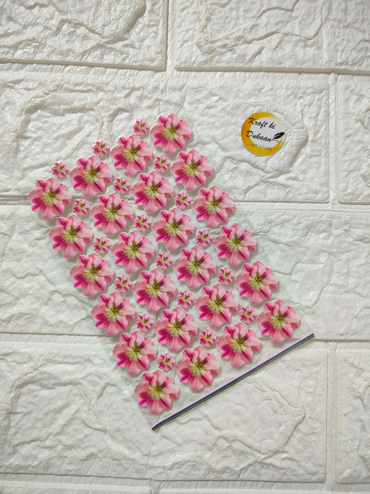 Pink flower UV DTF peel-off sticker sheet with small layered blossoms