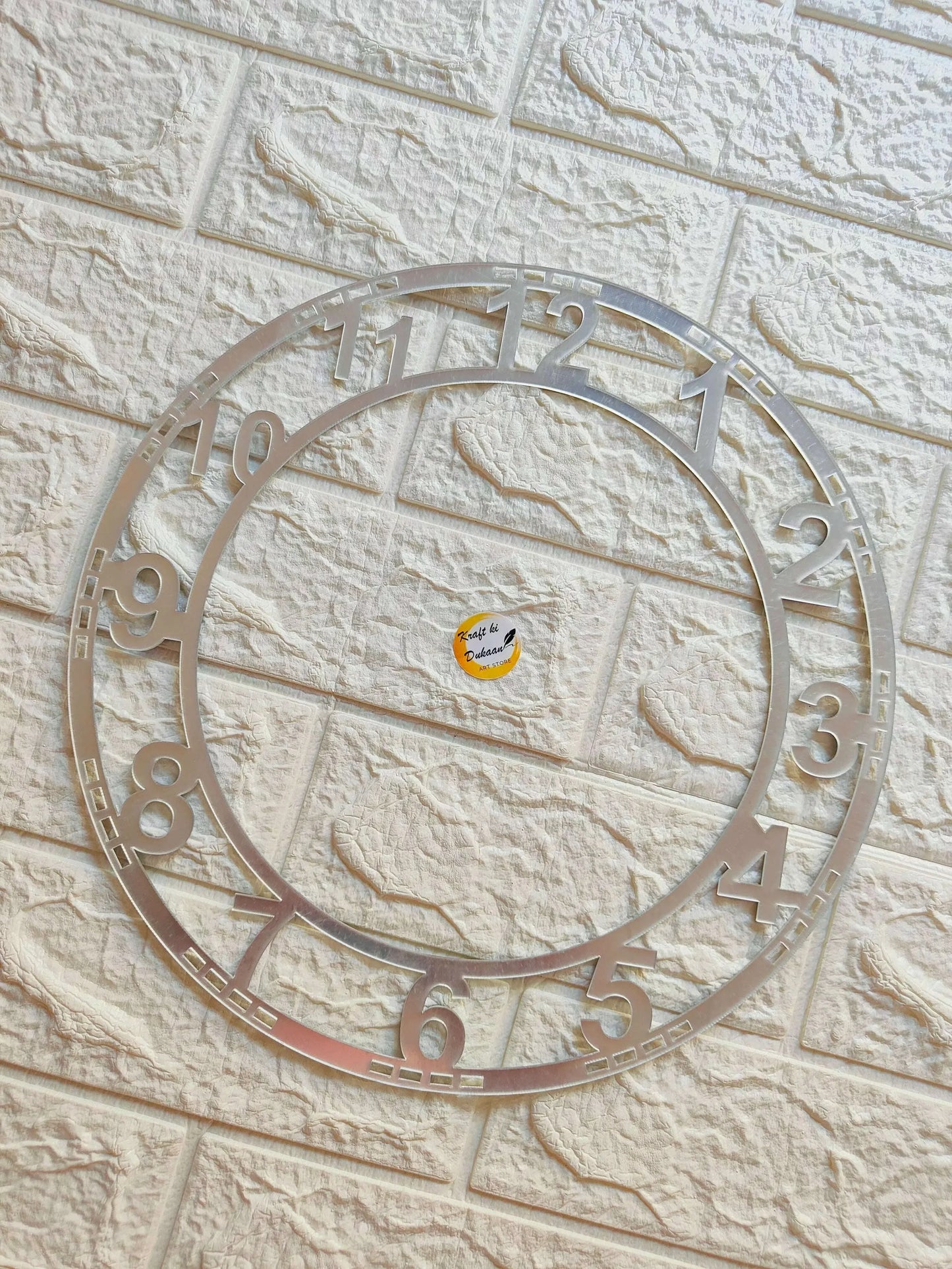 Silver acrylic clock number ring with inner circle and numbers 1–8 visible