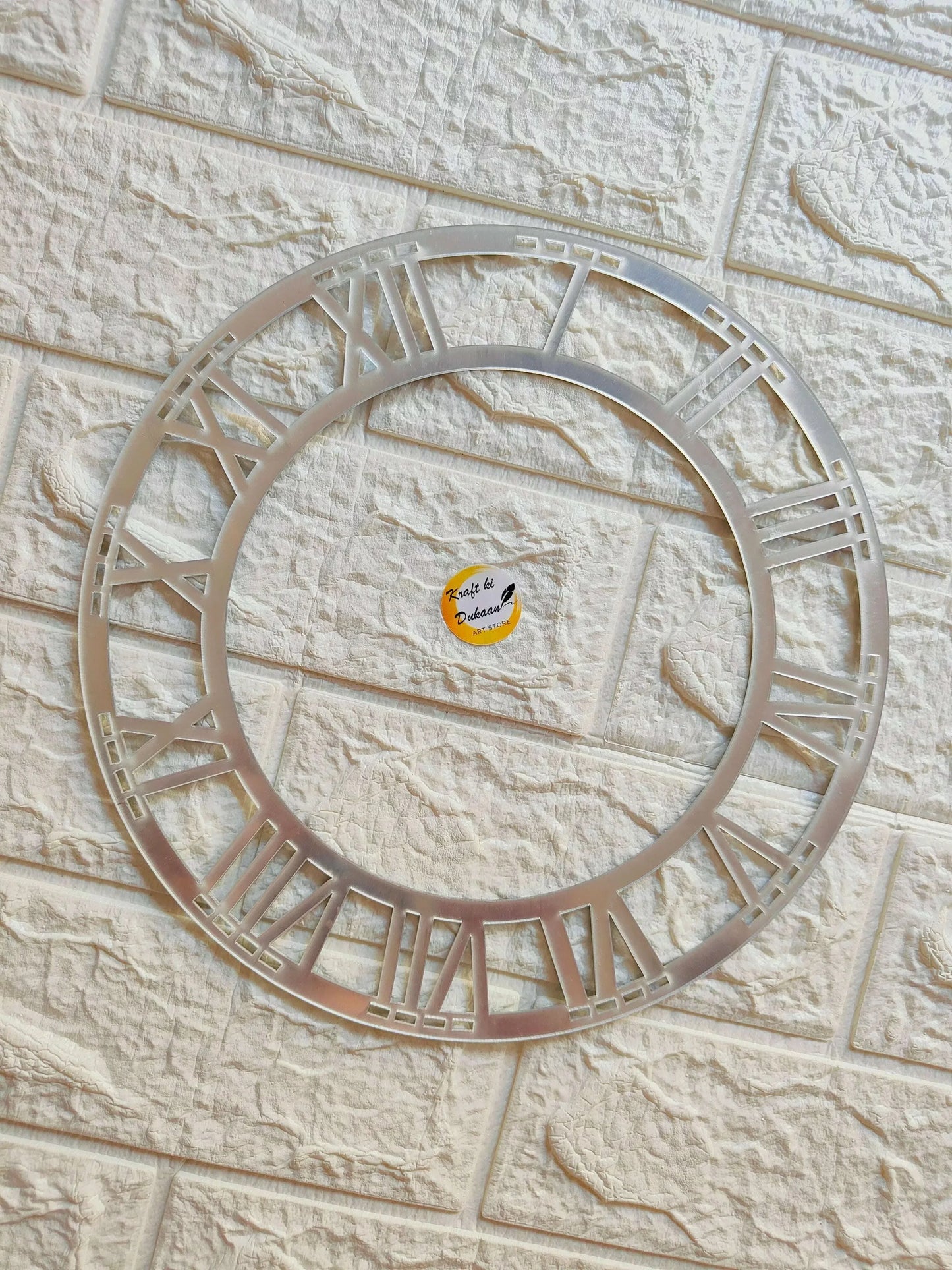 Kraft ki Dukaan silver acrylic clock ring with Roman numeral segments