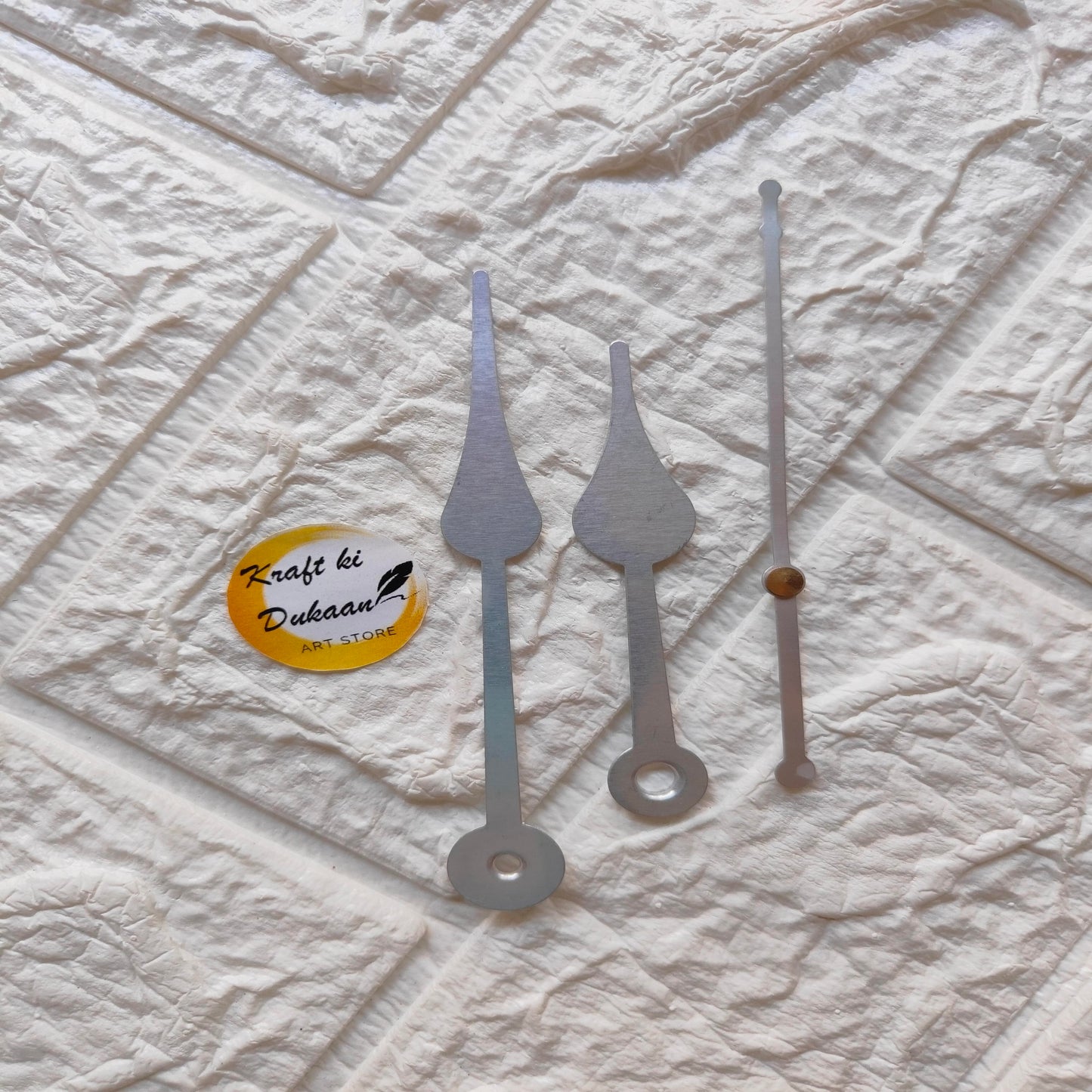 Silver clock hands replacement kit featuring three distinct styles for various clock designs
