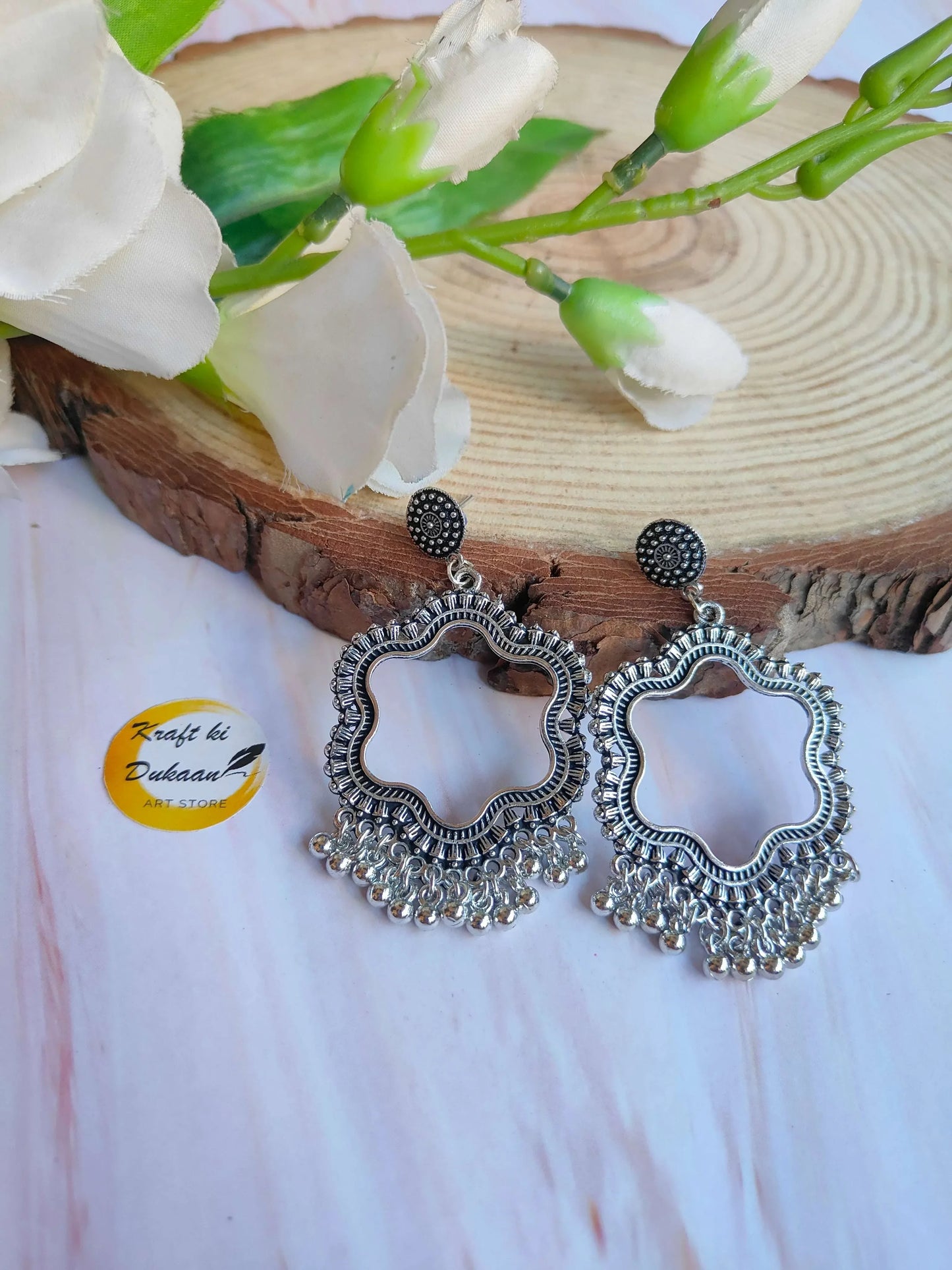 Silver jhumka drop earrings without beads, round filigree design with tassel fringe