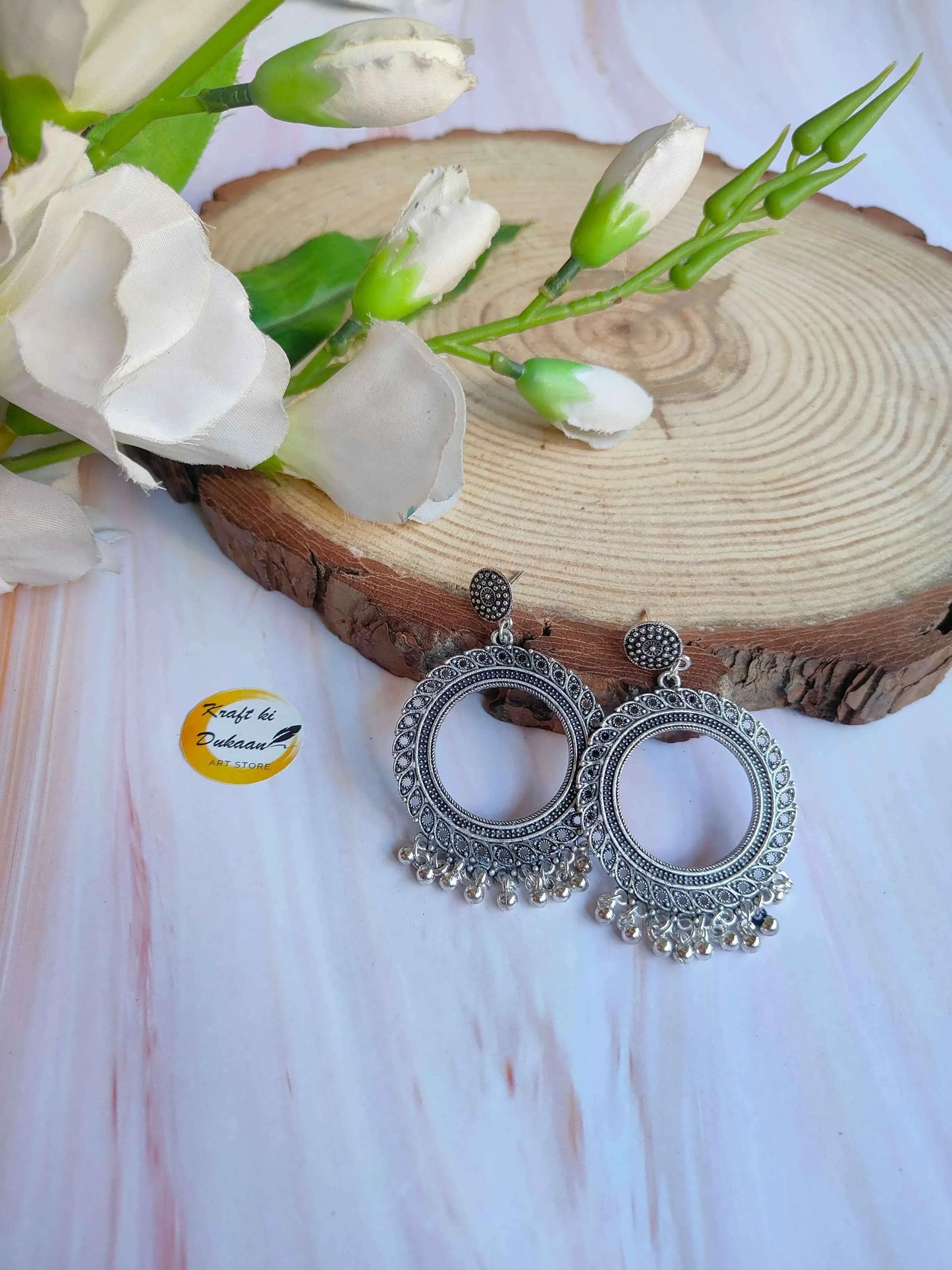 Silver jhumka earrings (no beads) with circular filigree and dangling tassels, B18