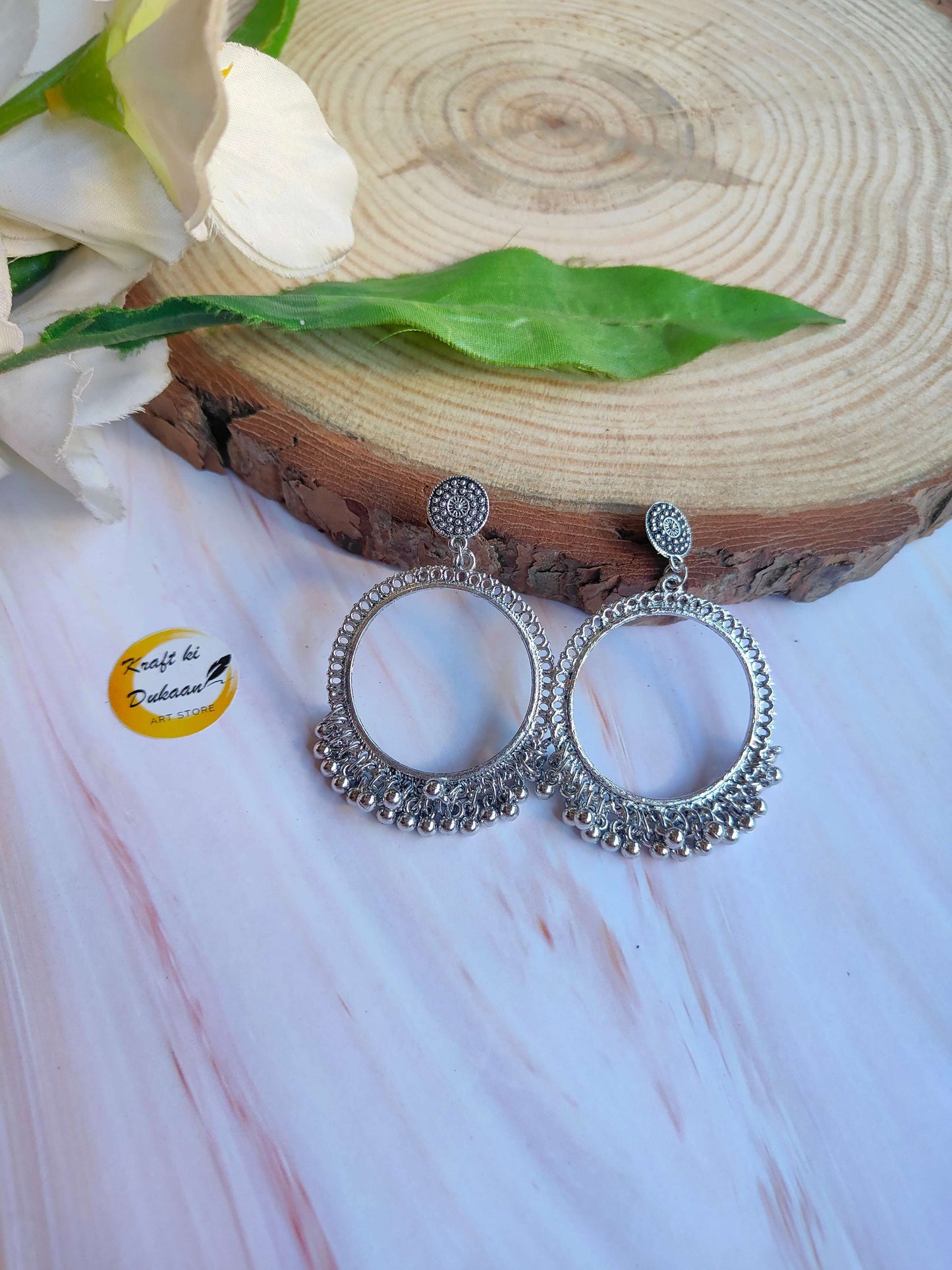 silver-jhumka-earrings-ornate-round-design