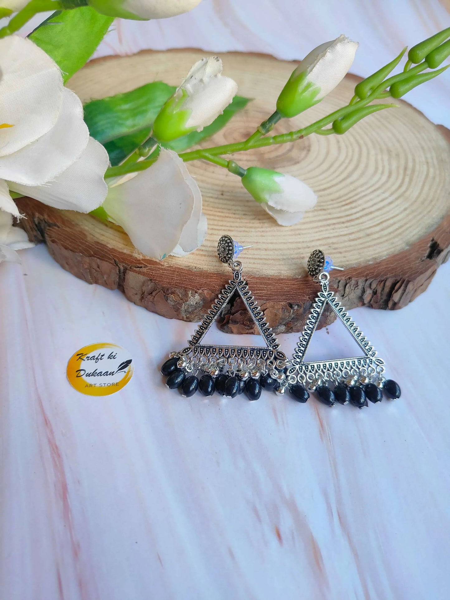 Silver jhumka earrings with beads; triangular design with dark beaded drops