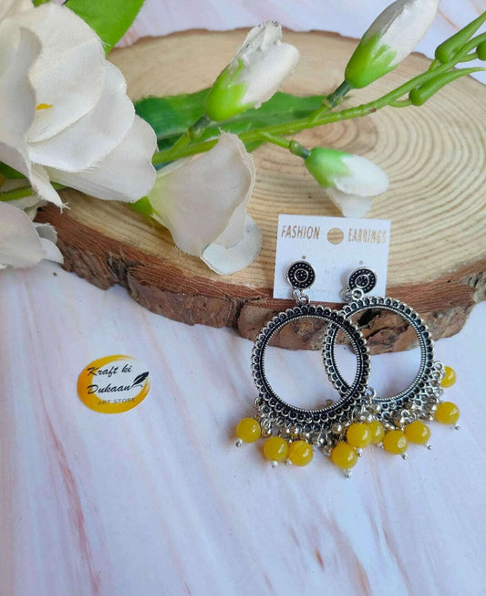 silver-jhumka-earrings-with-beads-yellow