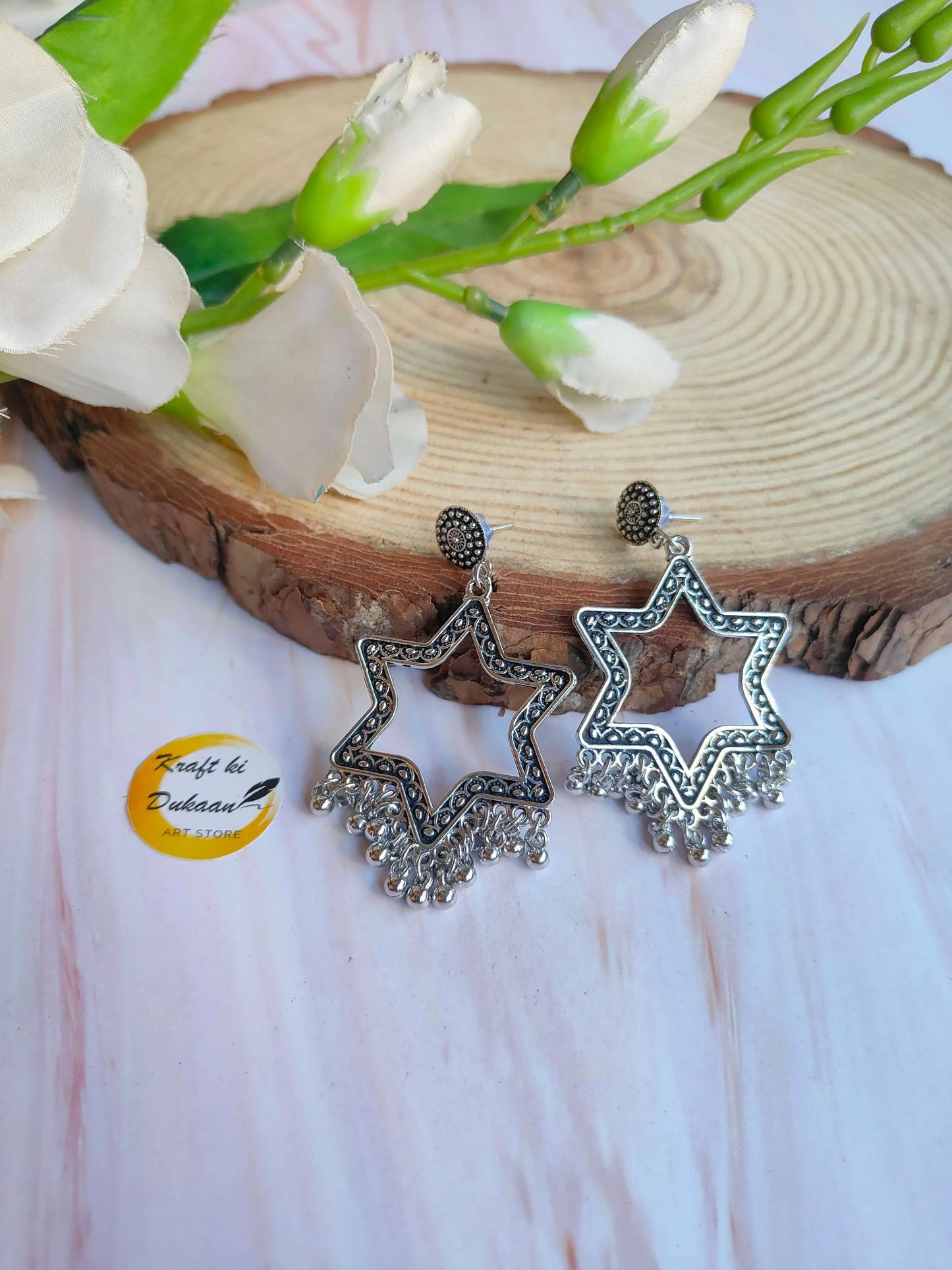 Silver star-shaped jhumka earrings without beads (B9) with textured dangling drops