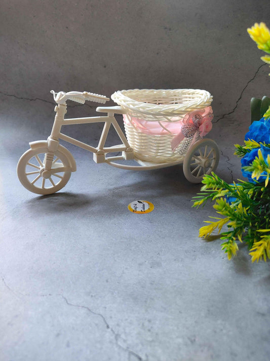 Charming wicker cycle basket decor with a delicate design, perfect for home or garden display