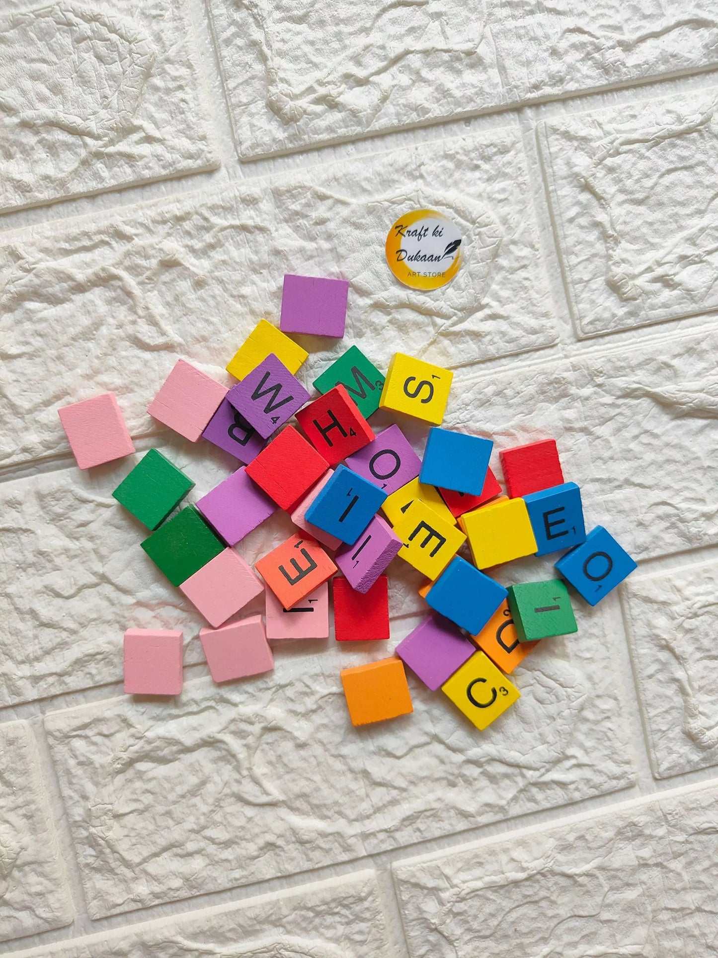 Wooden color alphabet blocks: multicolored square letters on wooden face.