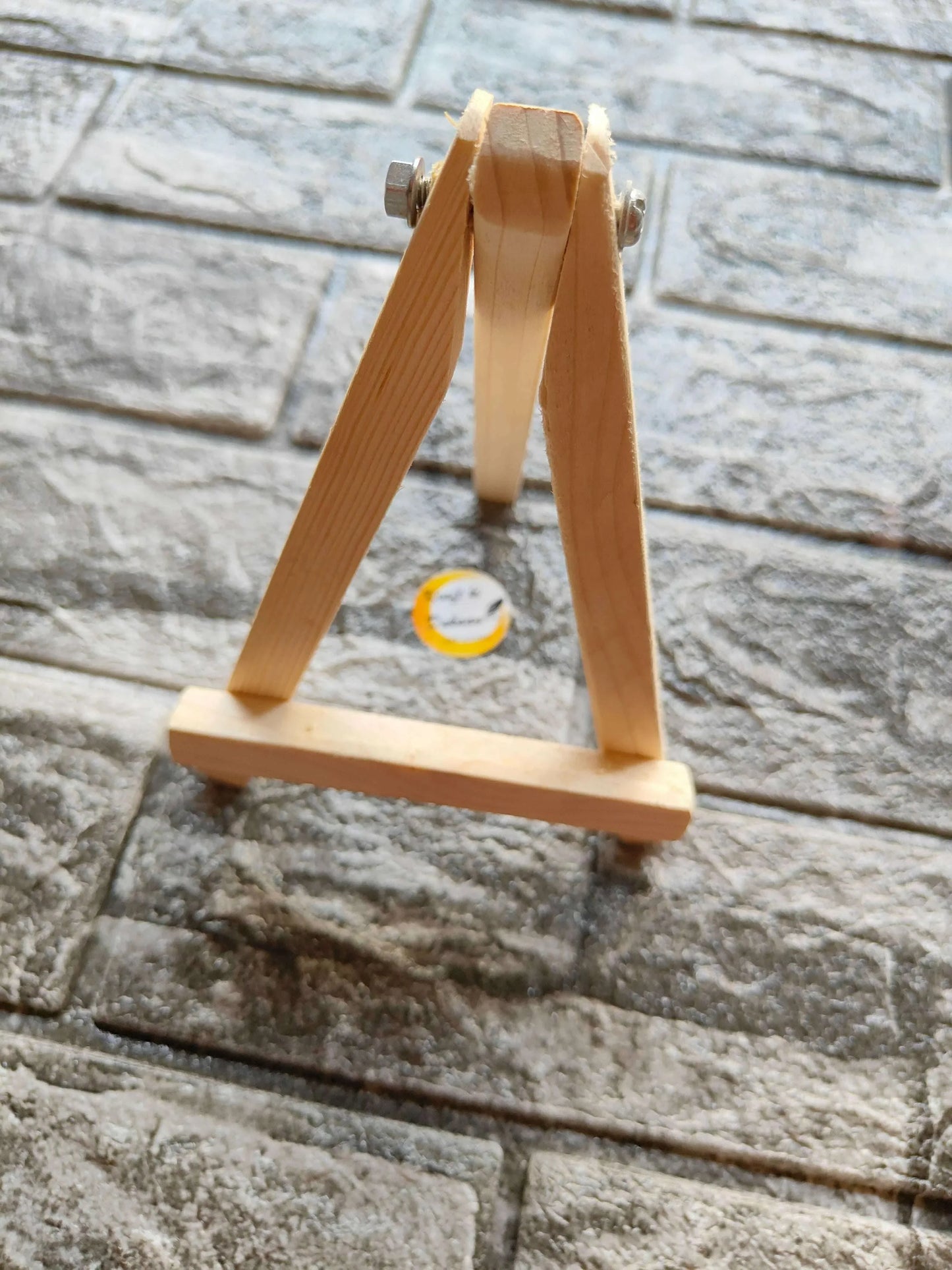 8" wooden easel stand side view with screw hardware on top frame