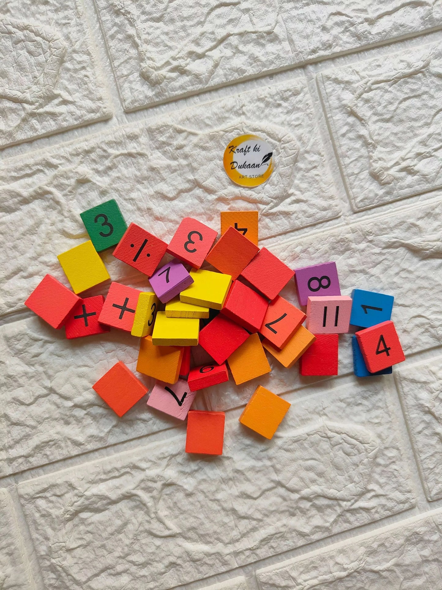 Wooden color number block set with small painted blocks showing numerals and symbols