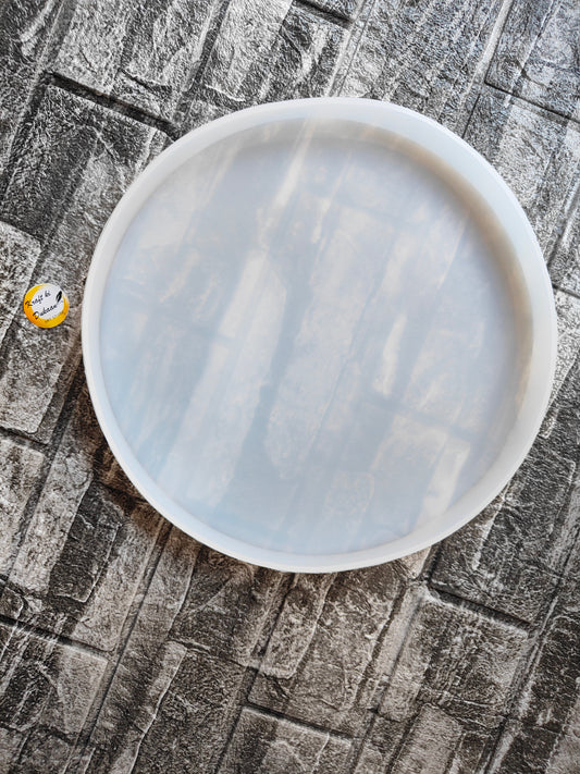 10 inch round mould for resin art displayed on a textured surface for crafting projects
