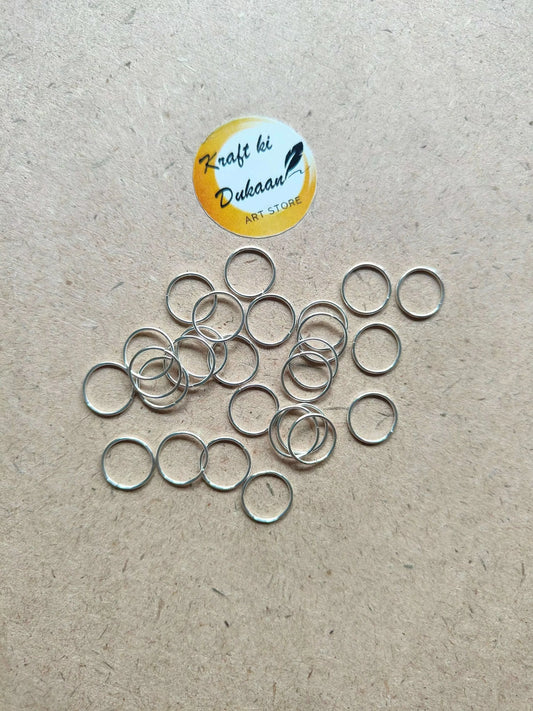10mm-silver-connector-rings-collection-on-surface-25-pieces