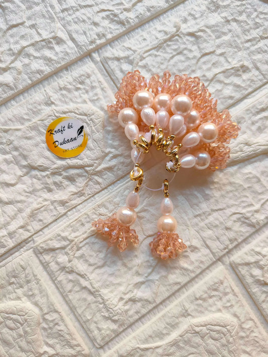 Peach beaded latkan set with pearl clusters and gold hooks, tassel drops