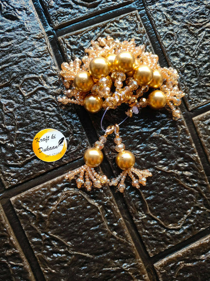 Gold beaded tassel latkan set with dangling pearl-like spheres and sparkly net