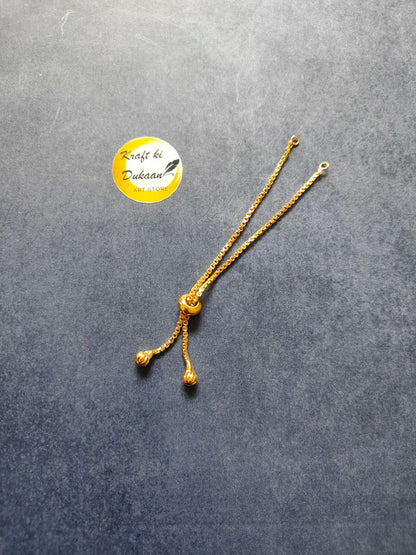 Golden bracelet chain with three small bead dangles and linked clasp