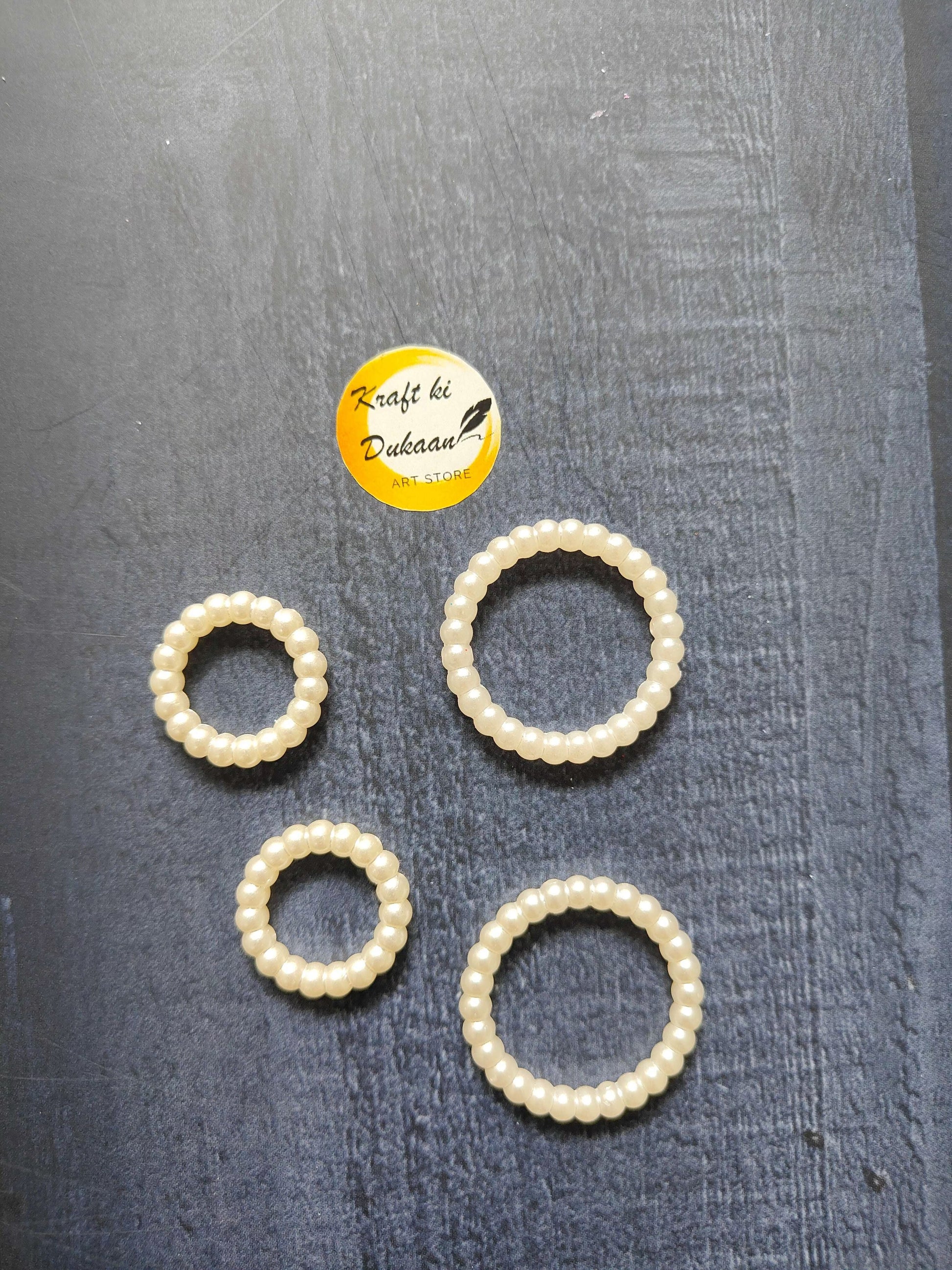 White pearl bead ring set, 5 round rings in view