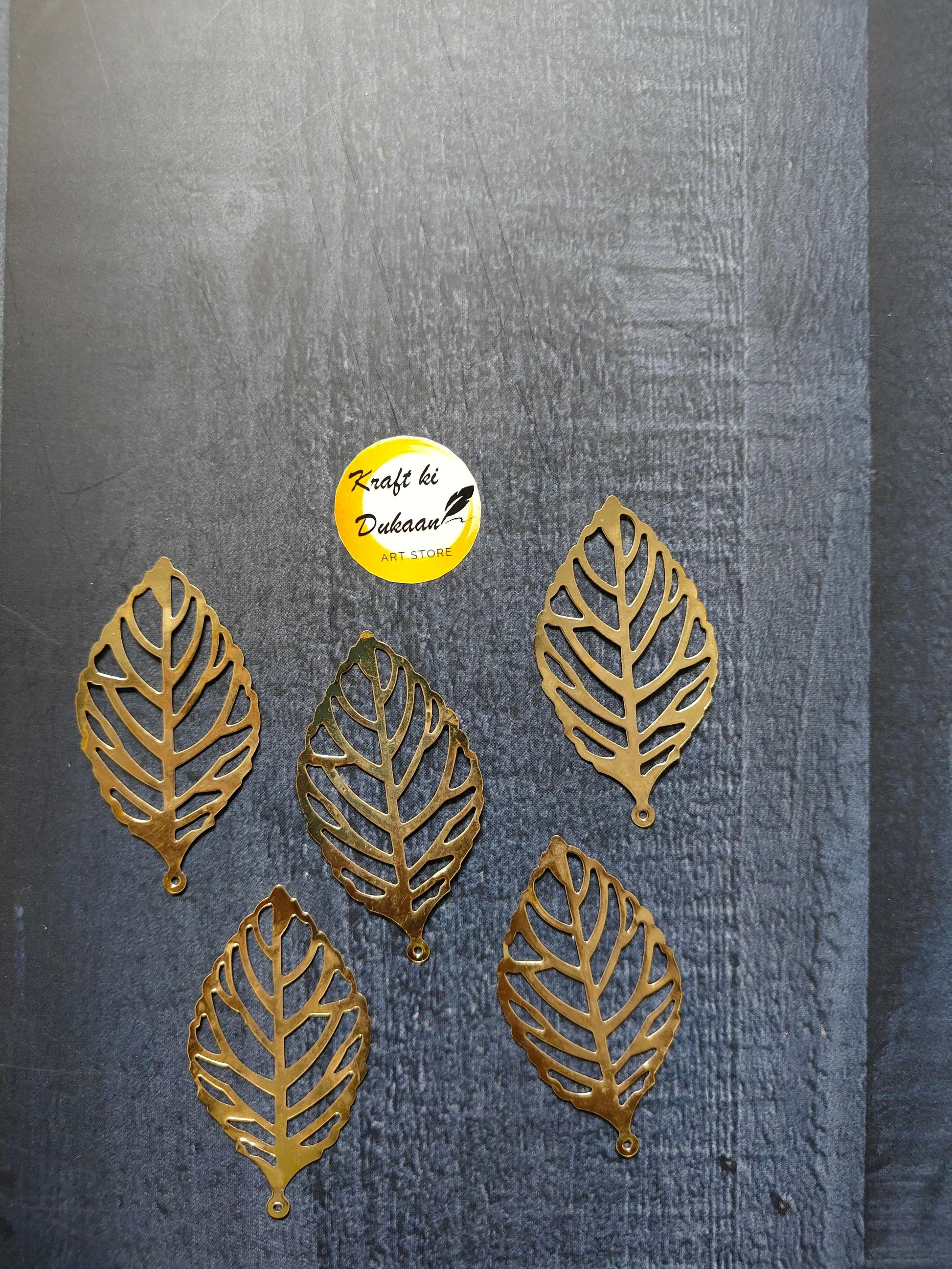 Metal leaf A2 toppers: gold leaf cutouts with vein lines and loop stems