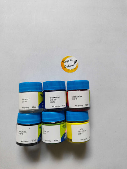 6 fabric paint bottles with blue caps and shade labels: white, ultramarine, crimson, green