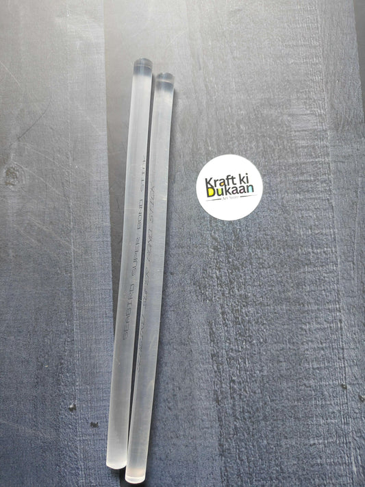 Hot melt glue sticks, two clear sticks with printed markings