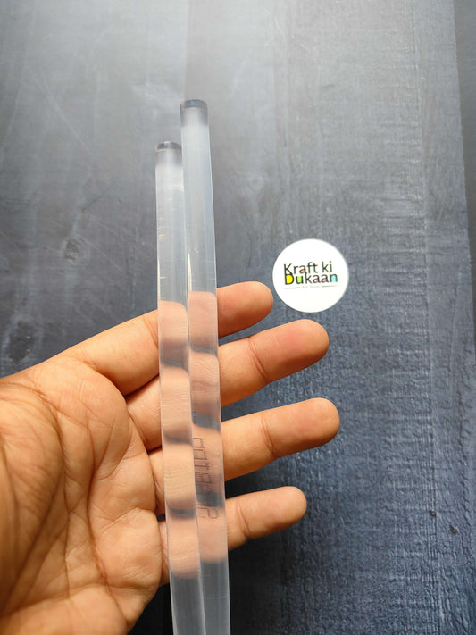 Hot melt glue sticks (pack of 2), clear sticks held in hand