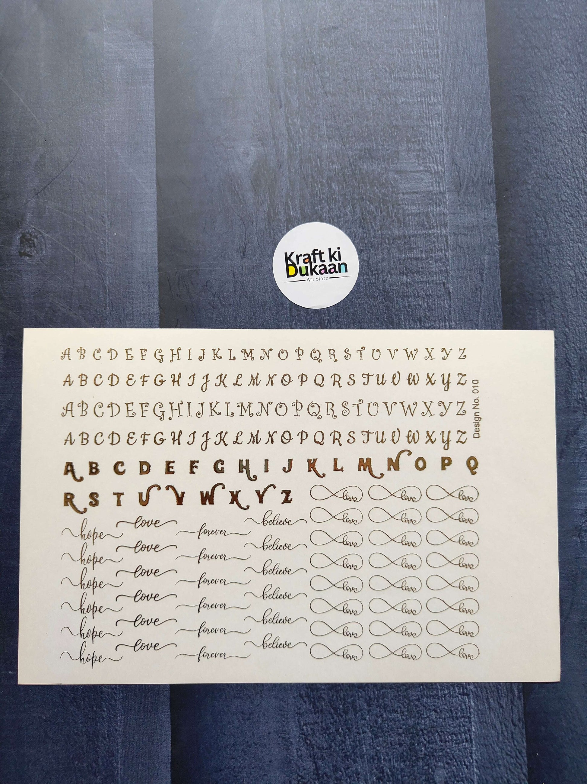 A5 gold embossed sticker sheet with alphabet, “love” script, and heart outlines