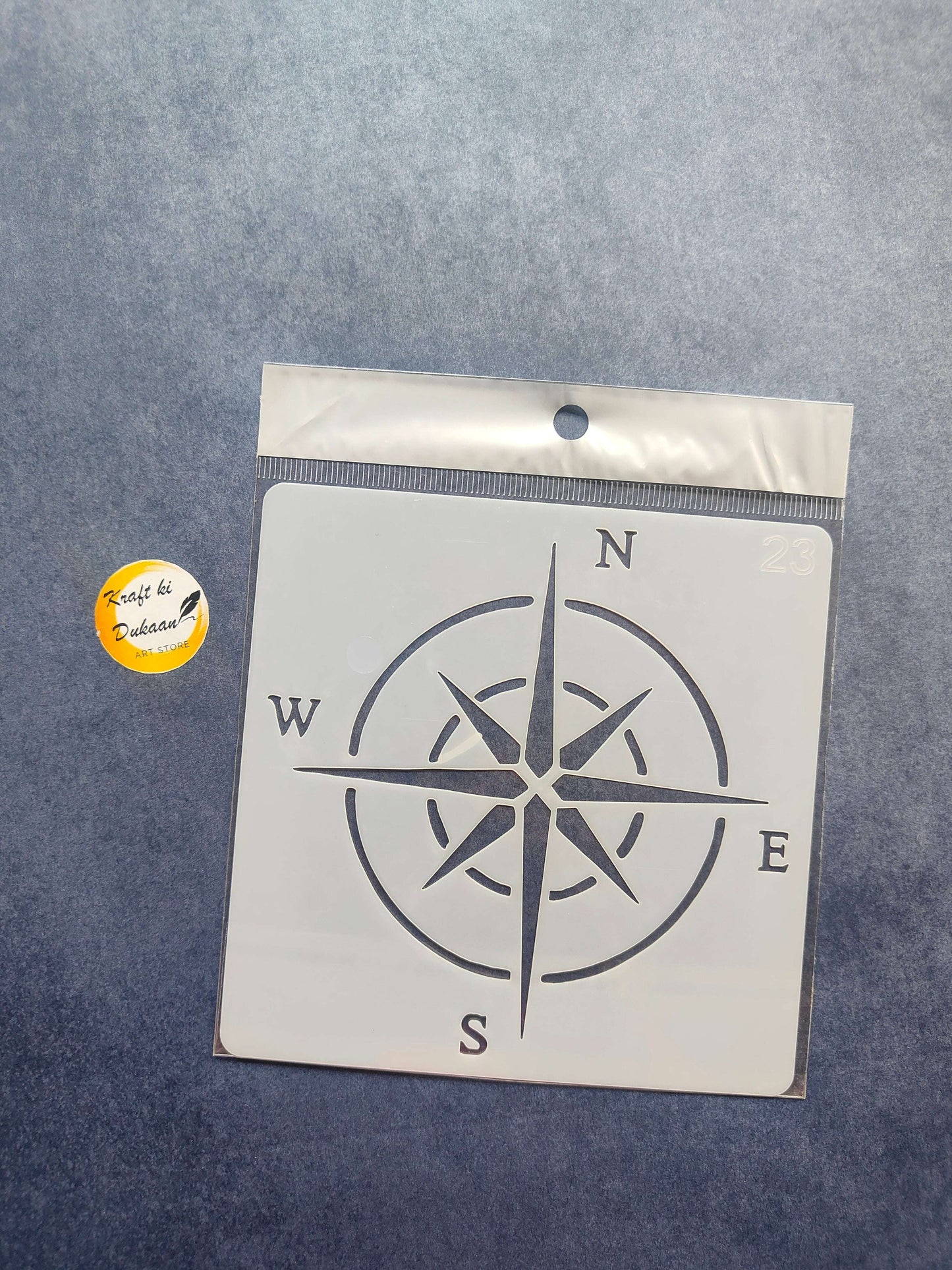 Stencil 29 compass rose with cardinal letters N, E, S, W and spoke cutouts