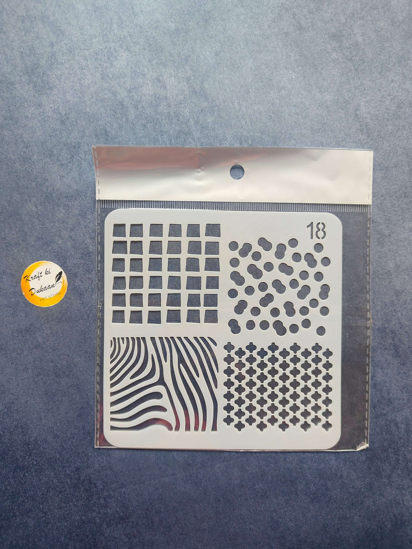 Stencil S18 with grid squares, dot clusters, and zigzag stripe cutout pattern