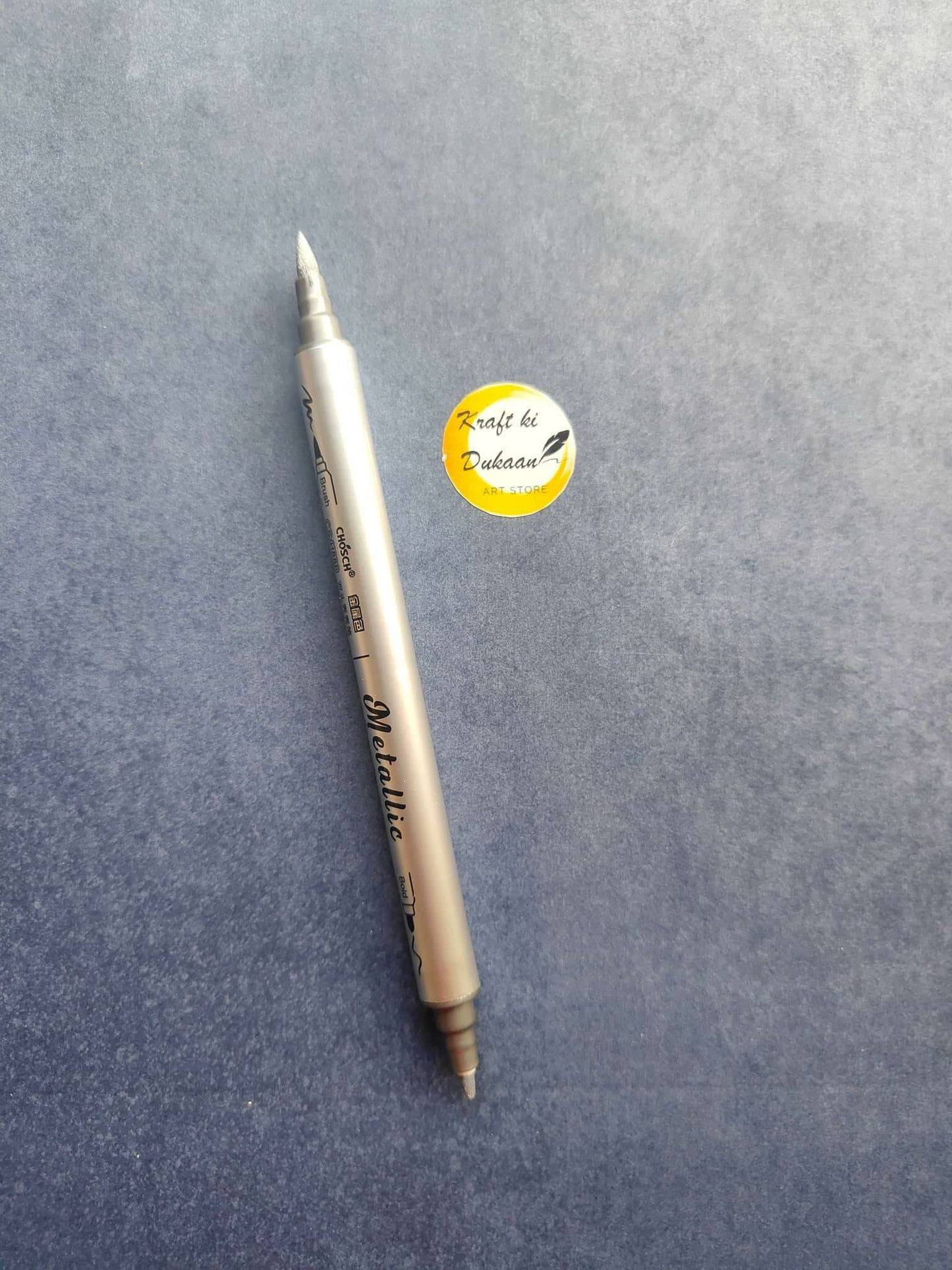 Silver metallic twin-tip marker with pointed ends