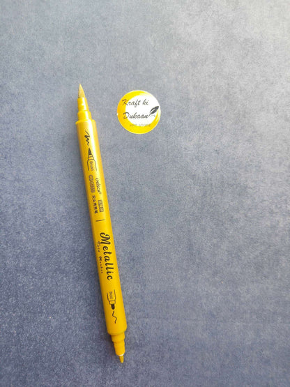 Gold metallic twin-tip marker with pointed ends