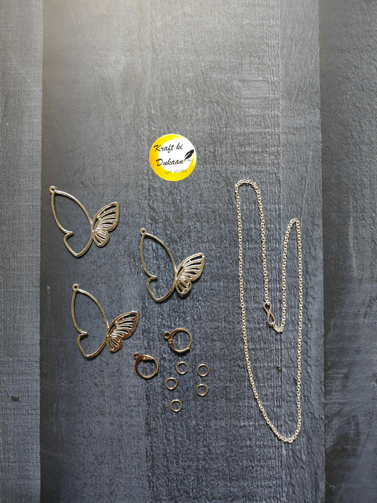 Butterfly earring and necklace set with multiple small rings; silver-tone jewelry set