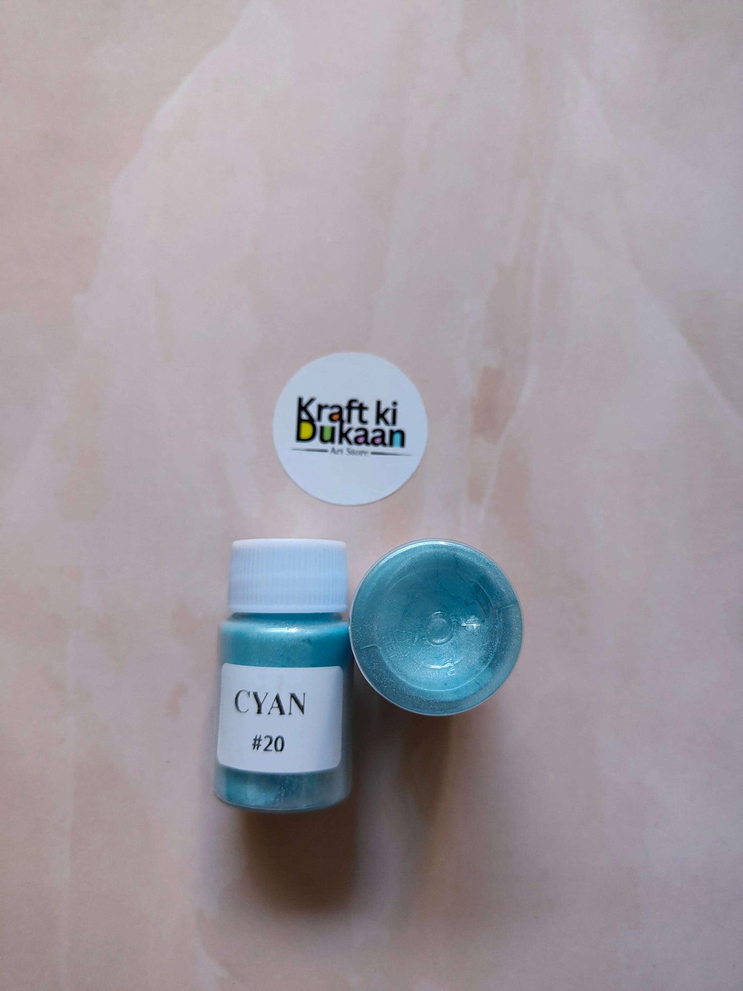 Cyan mica powder bottle, #20, teal-blue liquid in jar.