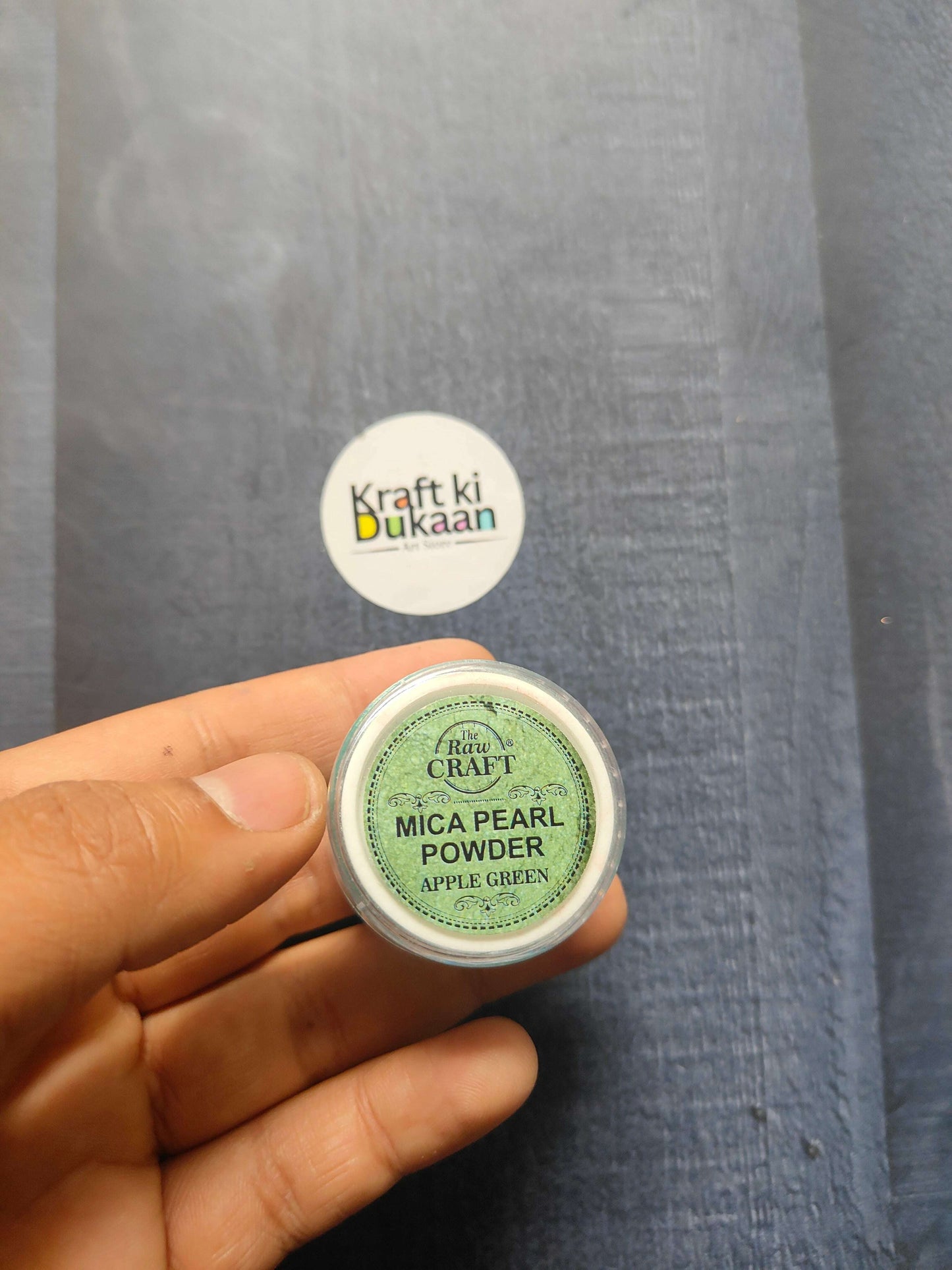 MICA Pearl Powder jar, Apple Green (15GM) held in hand