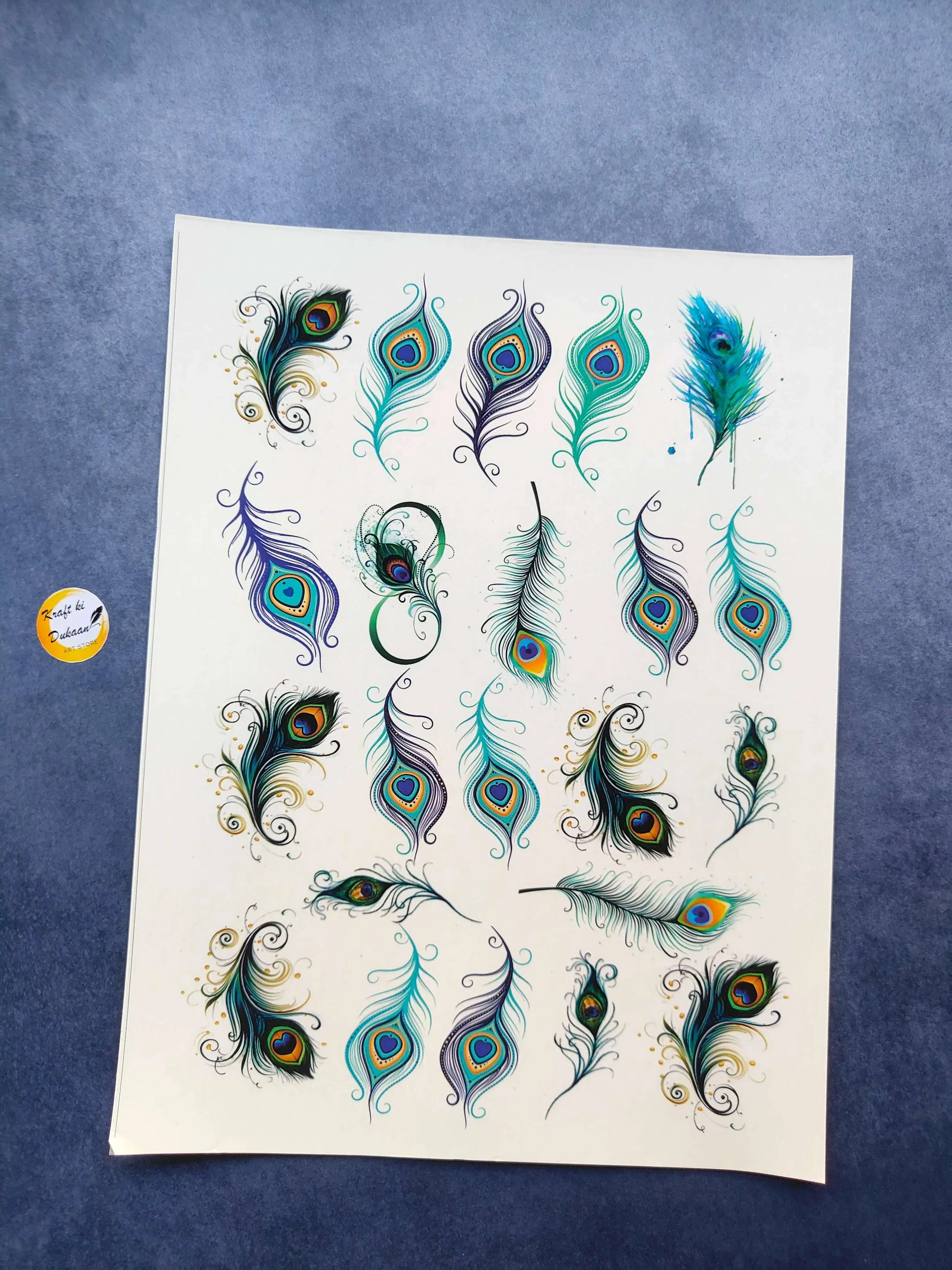 A4 colorful sticker sheet with peacock feather designs in teal, blue, and green