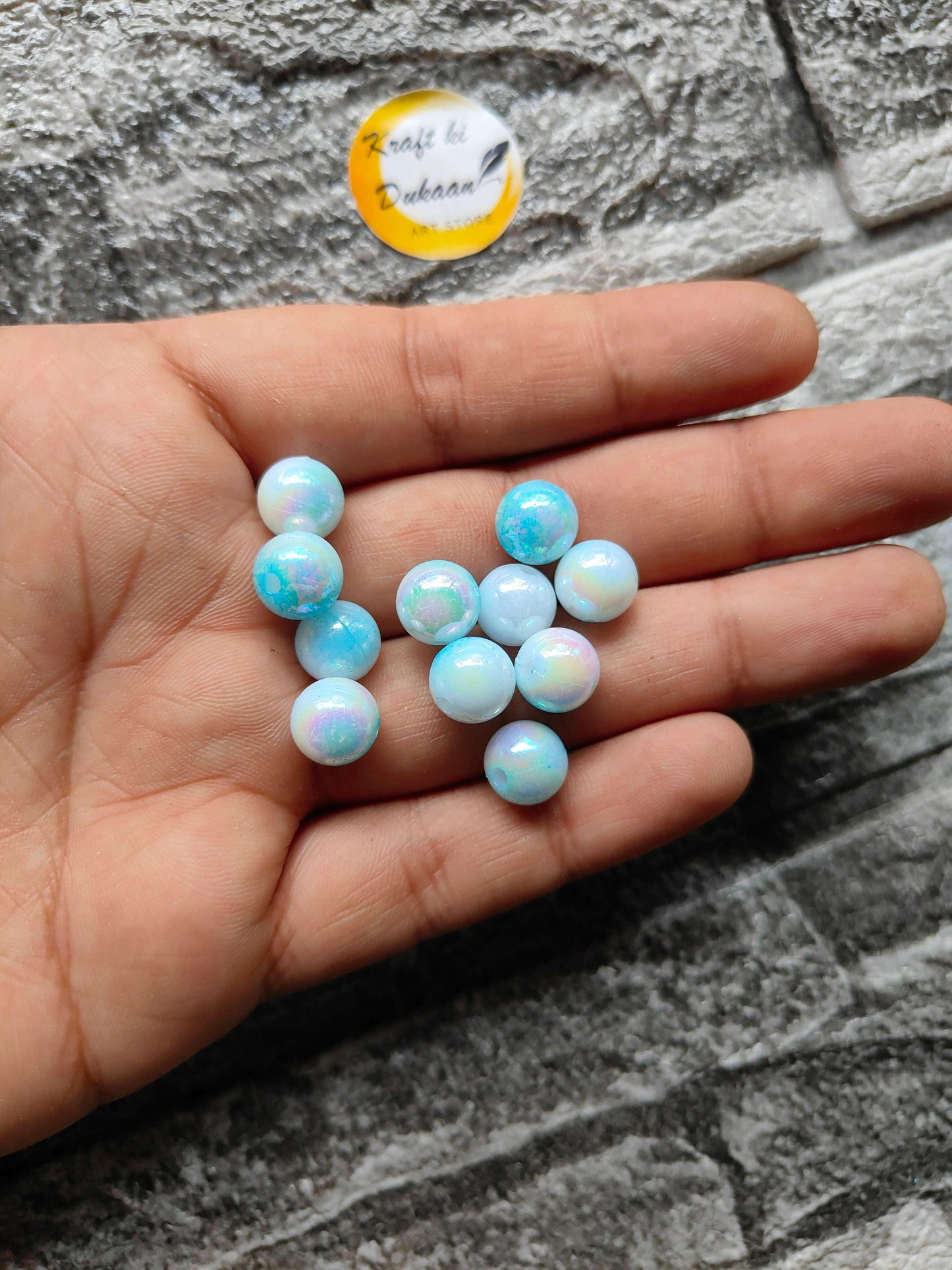 abs-rainbow-skyblue-beads-handful-of-beads