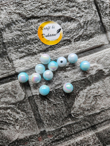 abs-rainbow-skyblue-beads-scattered-beads-on-surface