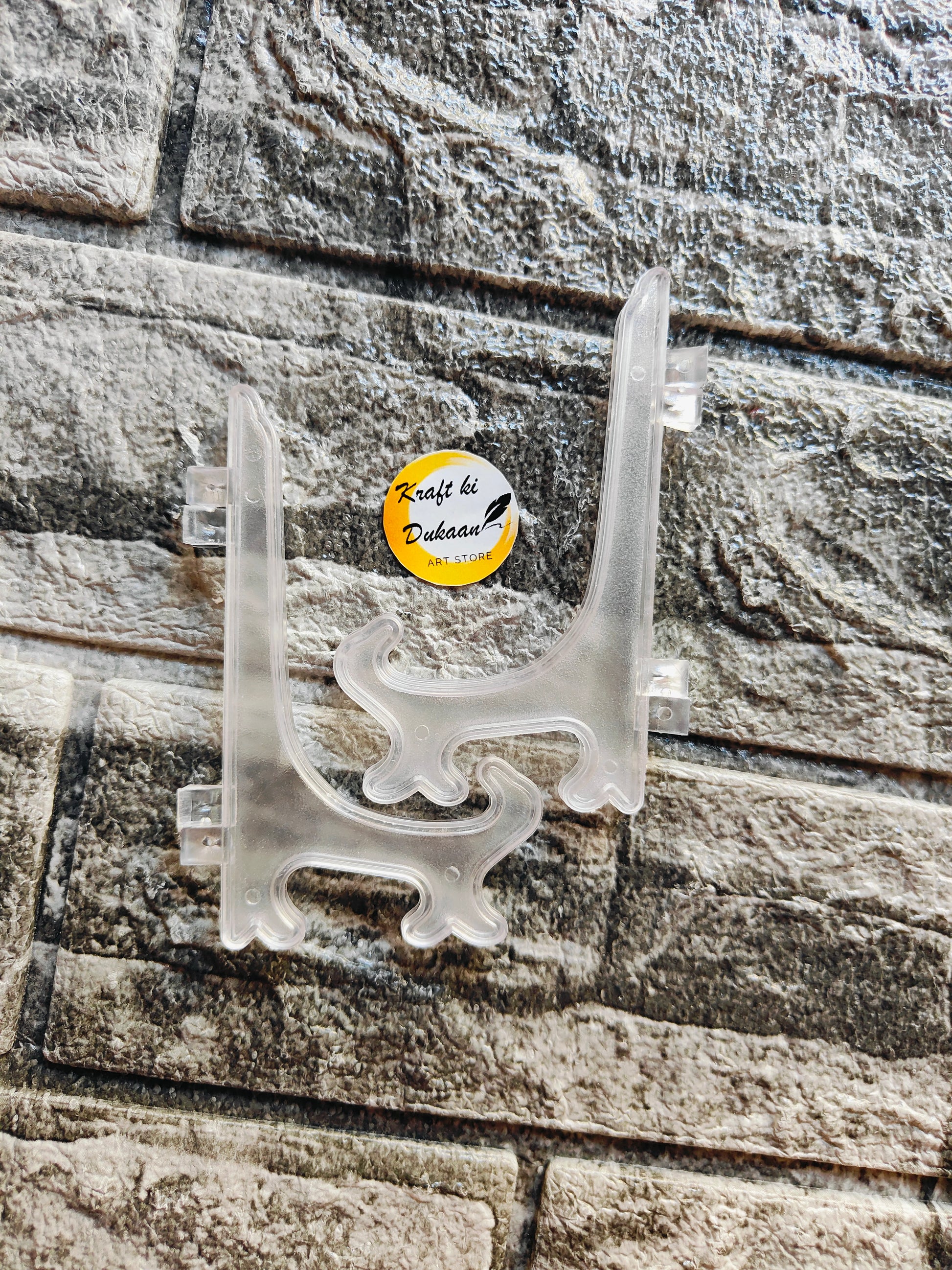 Clear acrylic display stand perfect for showcasing art or products with a sleek design