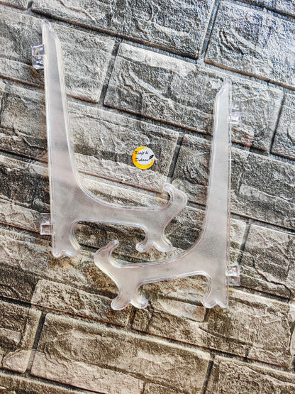 Clear acrylic display stand for showcasing books or collectibles with sturdy design
