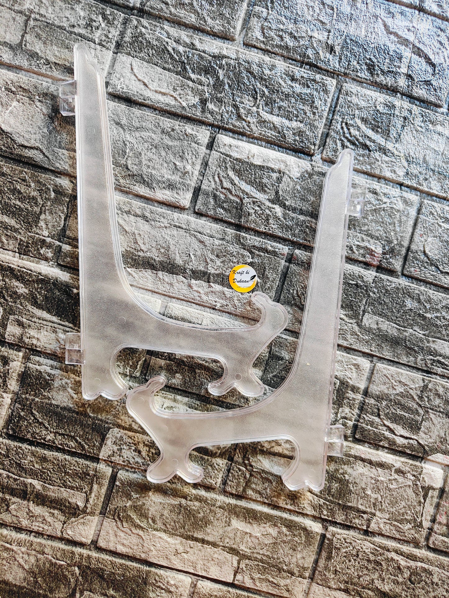 Set of two clear acrylic display stands for showcasing products and decorations