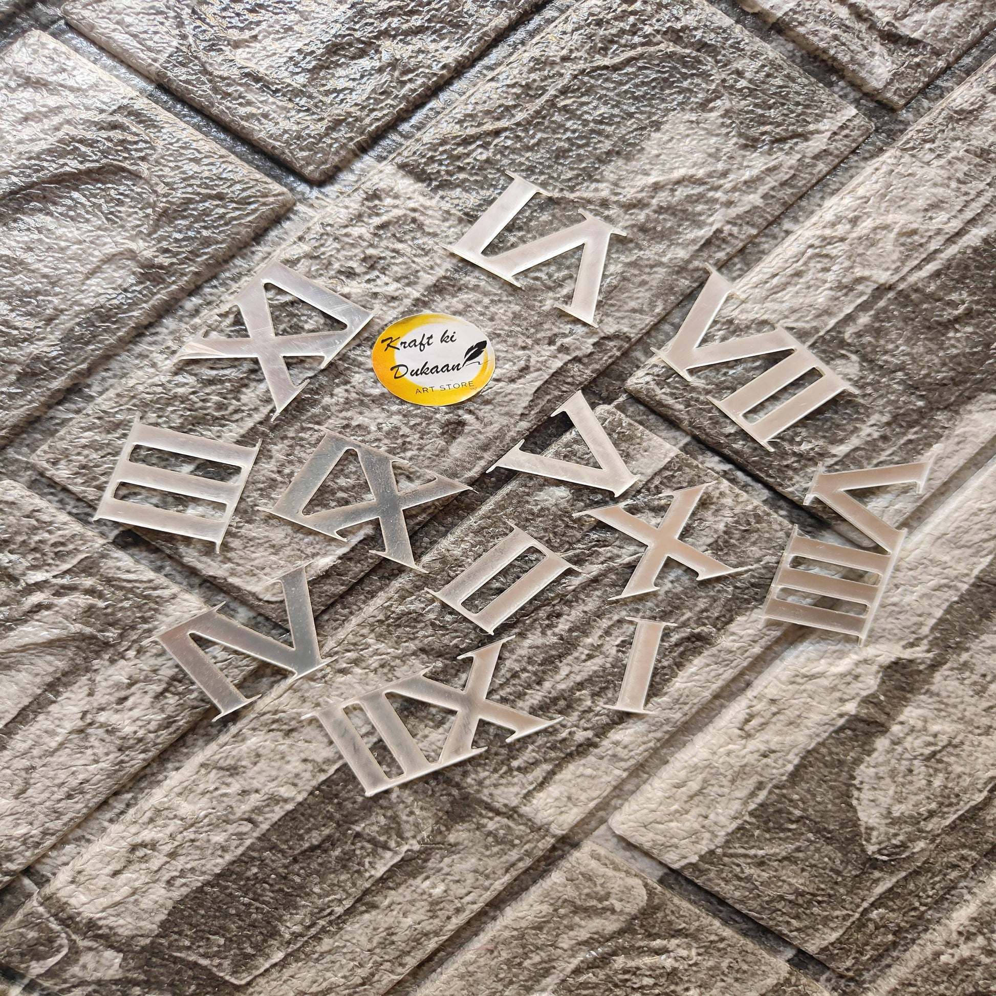 Set of acrylic Roman numerals for crafts arranged on a textured surface from Kraft ki Dukaan