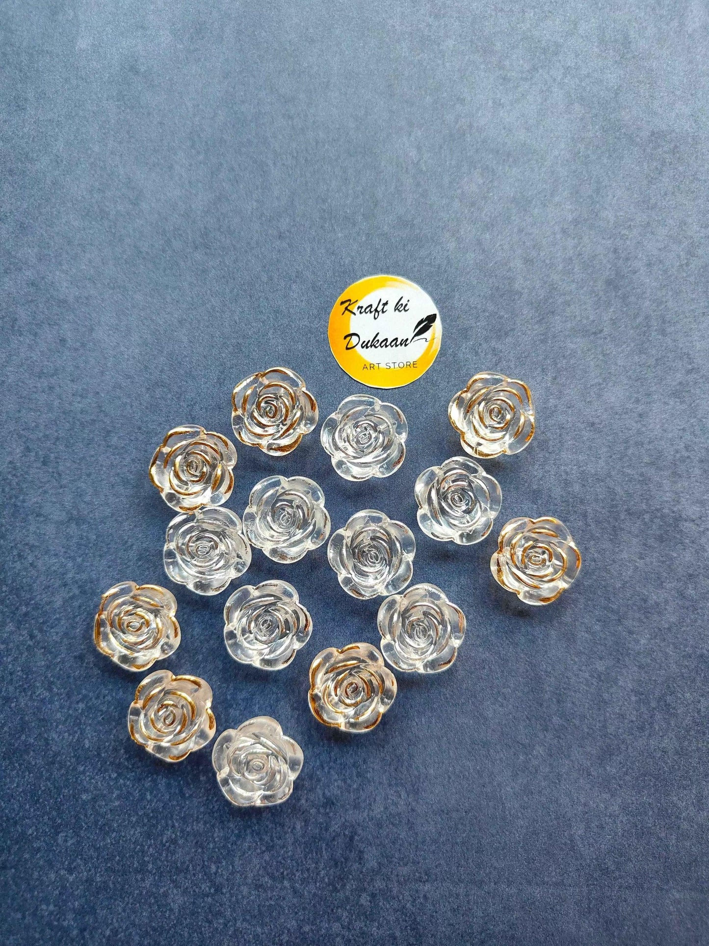Acrylic rose beads (pack of 50) in golden and clear translucent rose shapes