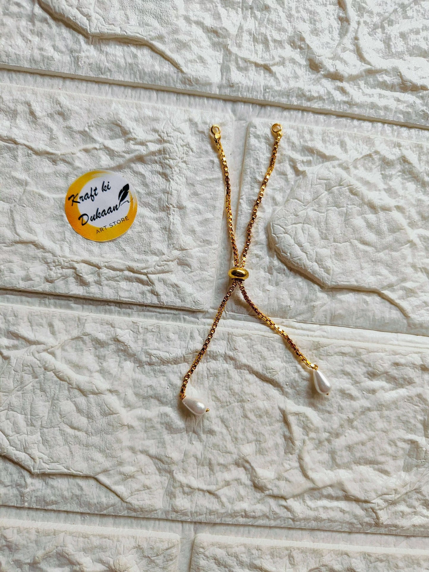 adjustable-gold-bracelet-chain-perl-ends-sleek-design
