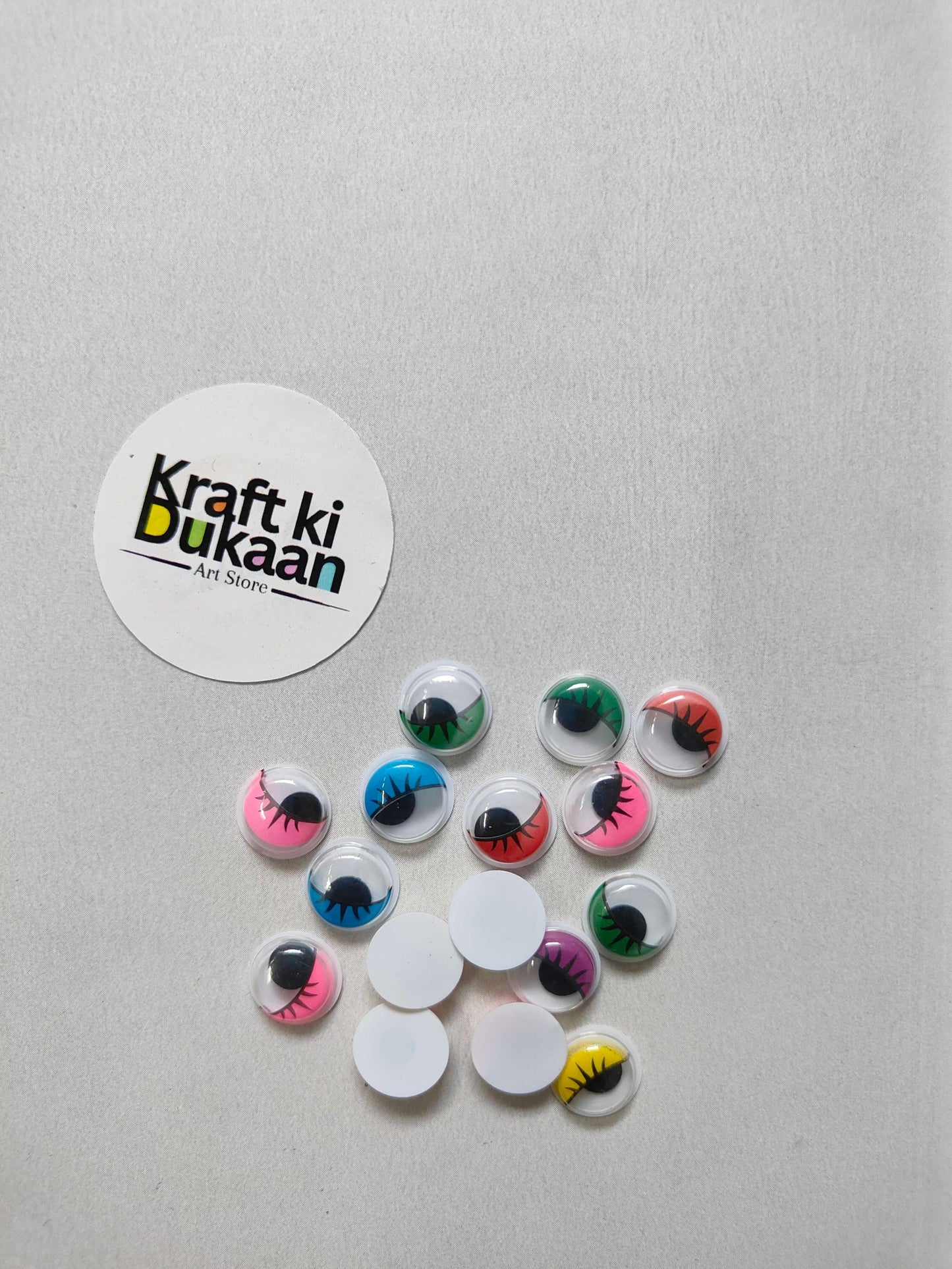 Colored googly eyes with black eyelashes, round domes