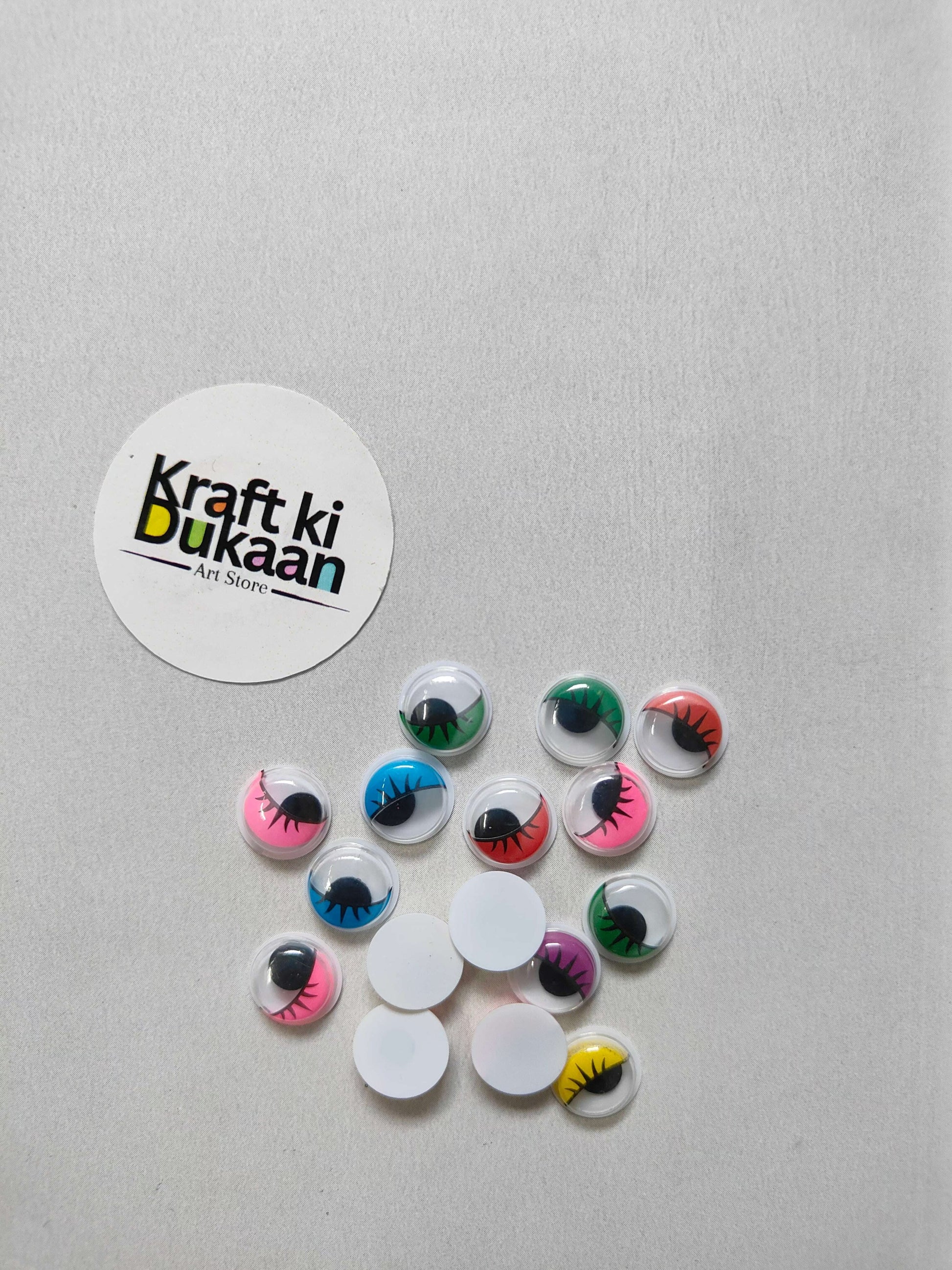 Colored googly eyes with black eyelashes, round domes