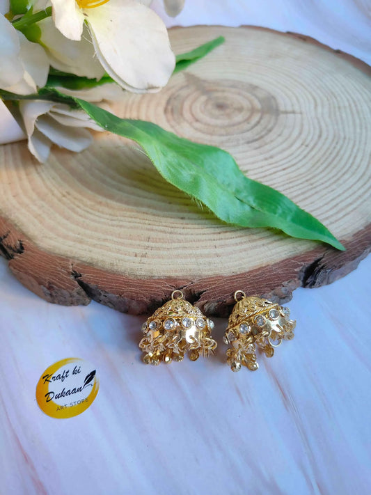 Gold jhumki earrings with diamond-style stones and dangling bead drops