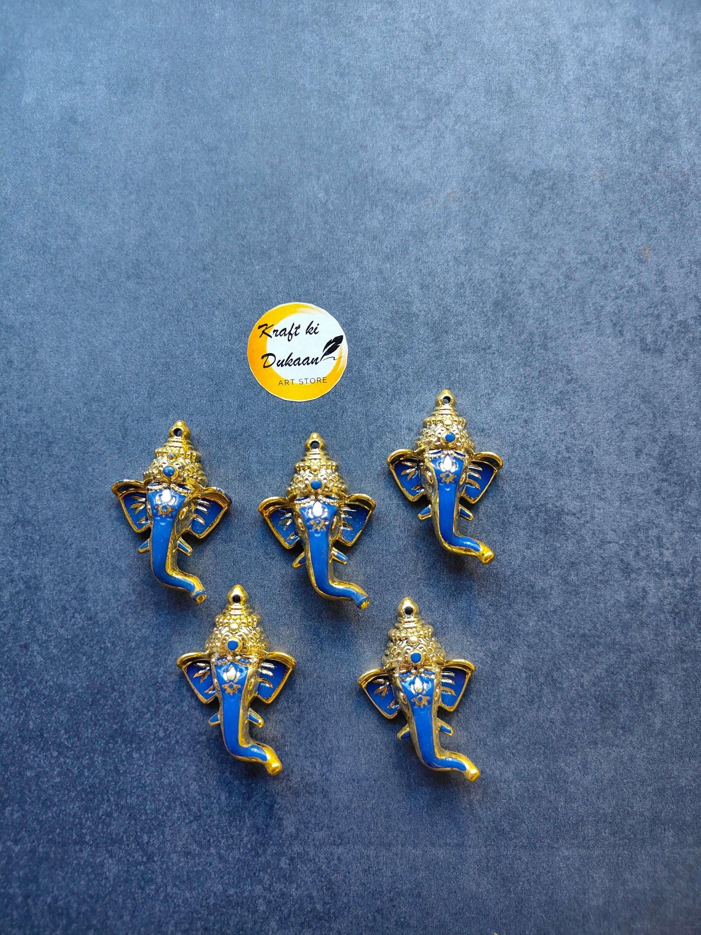 Small blue Ganpati figurines with gold crown and jeweled blue detailing, set of 5