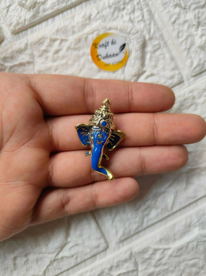 Blue Ganpati figurine held in hand with gold crown and blue jeweled accents
