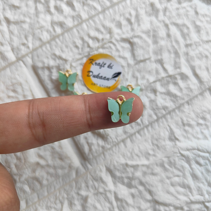 Delicate butterfly resin pendant charms in green, perfect for jewelry making and crafting