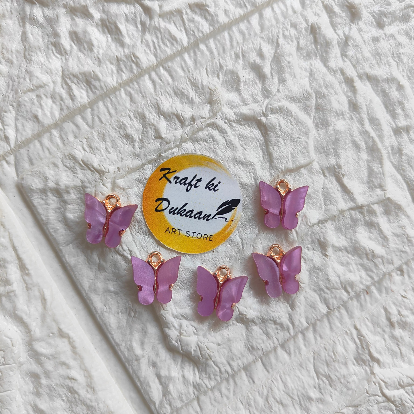 Set of butterfly resin pendant charms in lavender with gold accents for crafting and jewelry making